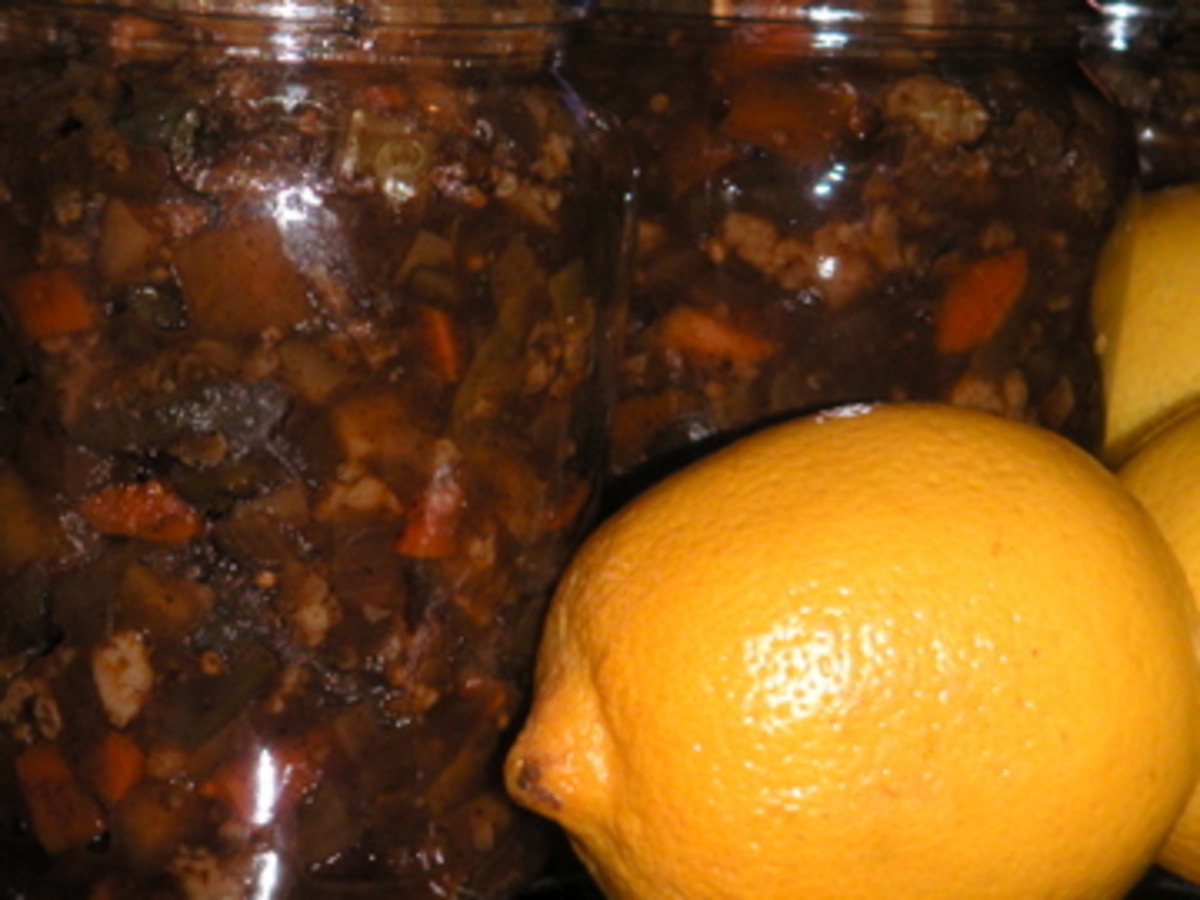 Jar of Branston Pickle next to a pickling jar filled with pickles