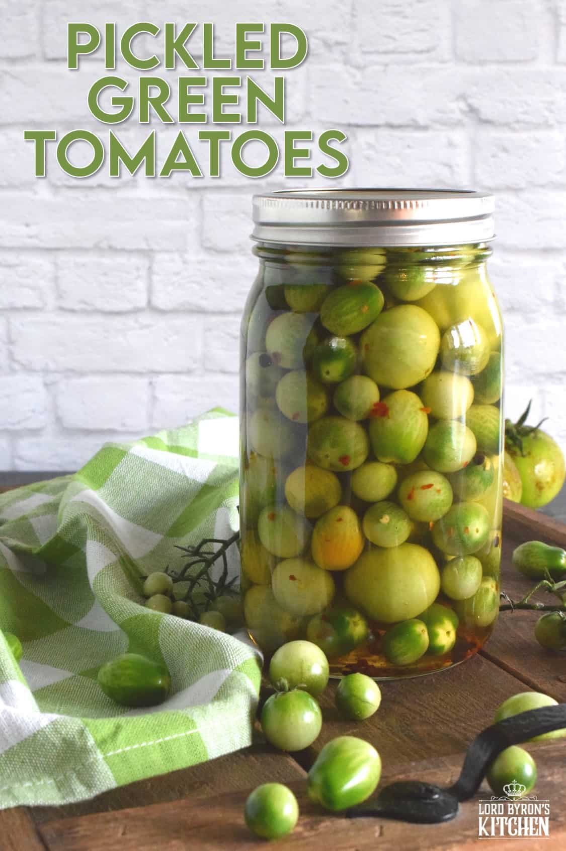 Pickling process of green tomatoes with jars, boiling brine, and finished pickles